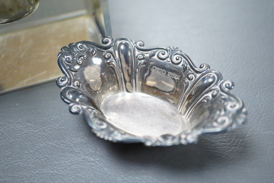 An Edwardian silver mounted cut glass square inkwell, by John Grinsell & Sons, Birmingham, 1901, width 10cm and a small silver pin dish.